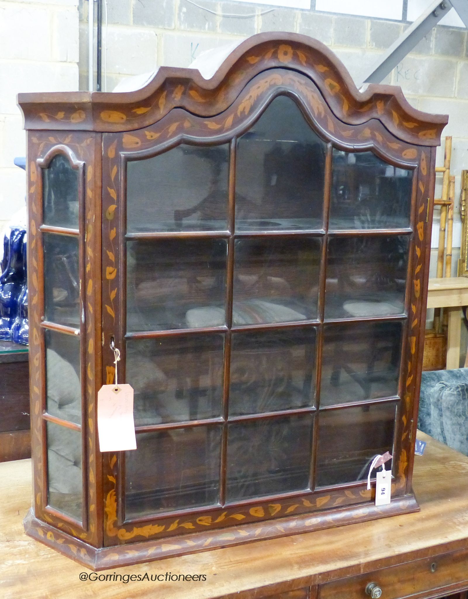 An early 19th century Dutch floral marquetry inlaid walnut and mahogany hanging display cabinet, width 86cm, depth 22cm, height 92cm